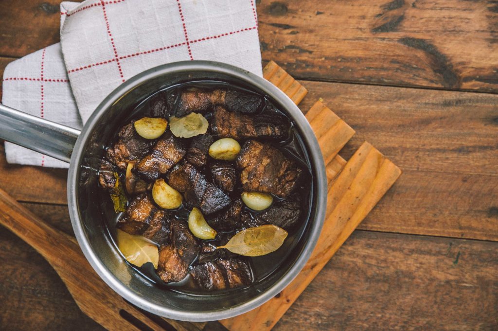 adobo in a pot on a table