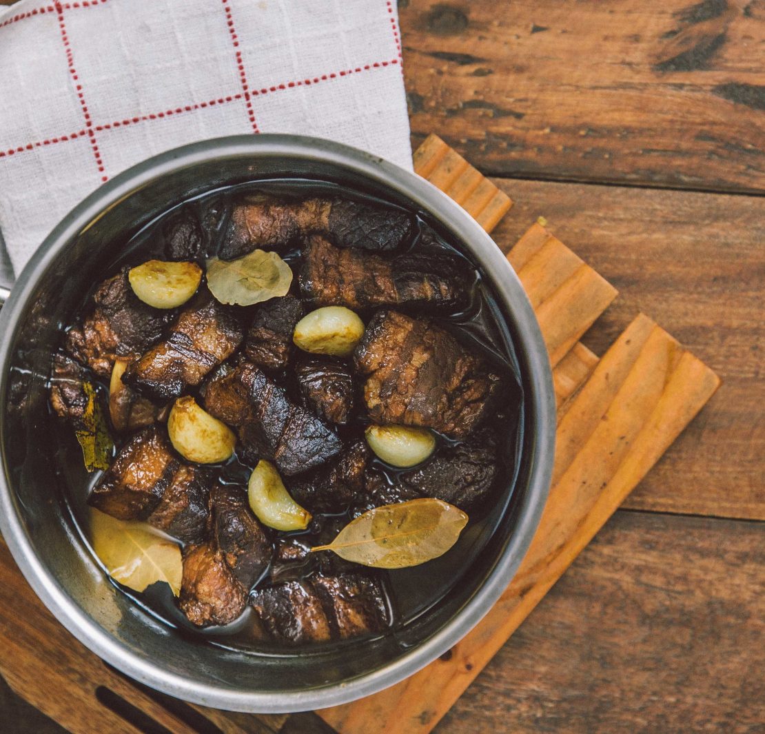 adobo in a pot on a table