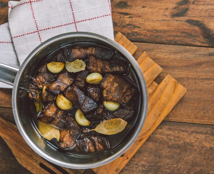 adobo in a pot on a table