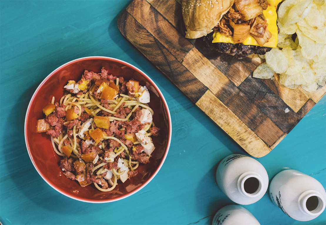 Breakfast favorites like longganisa, itlog na maalat, and kamatis top this pasta dish.