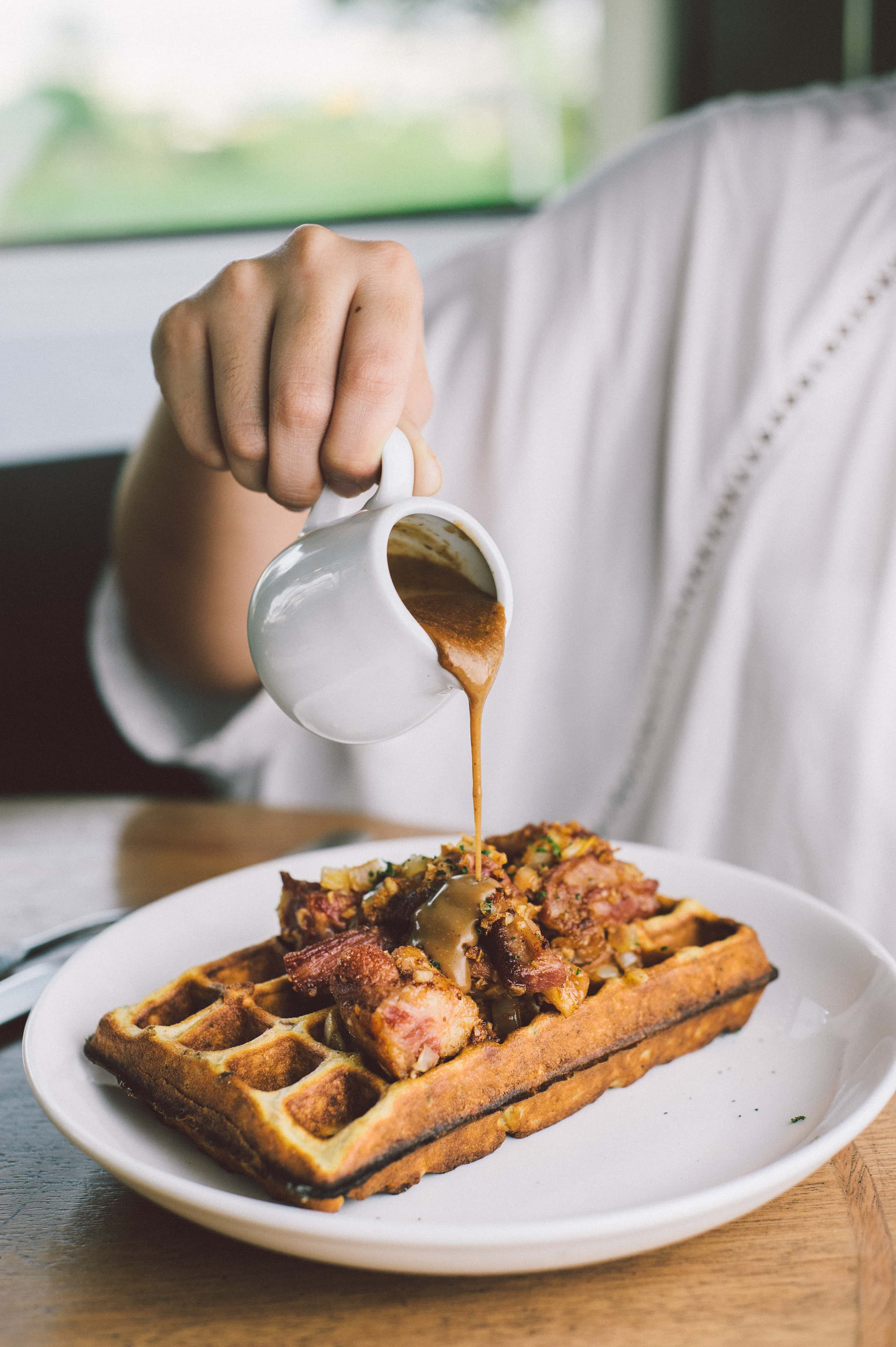 Porridge waffles with home-cured beef and peppercorn gravy