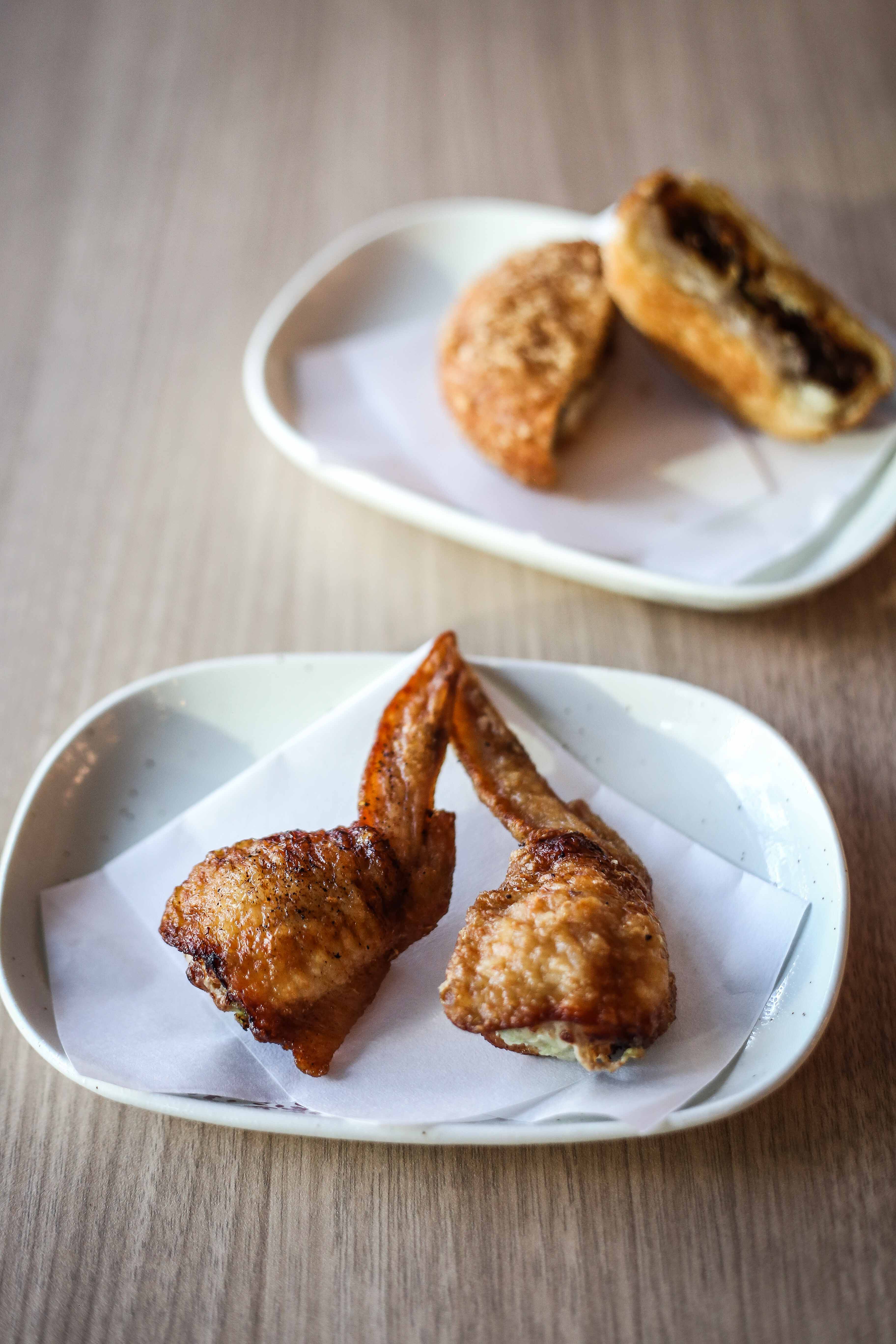 Chicken wing gyoza and curry doughnut