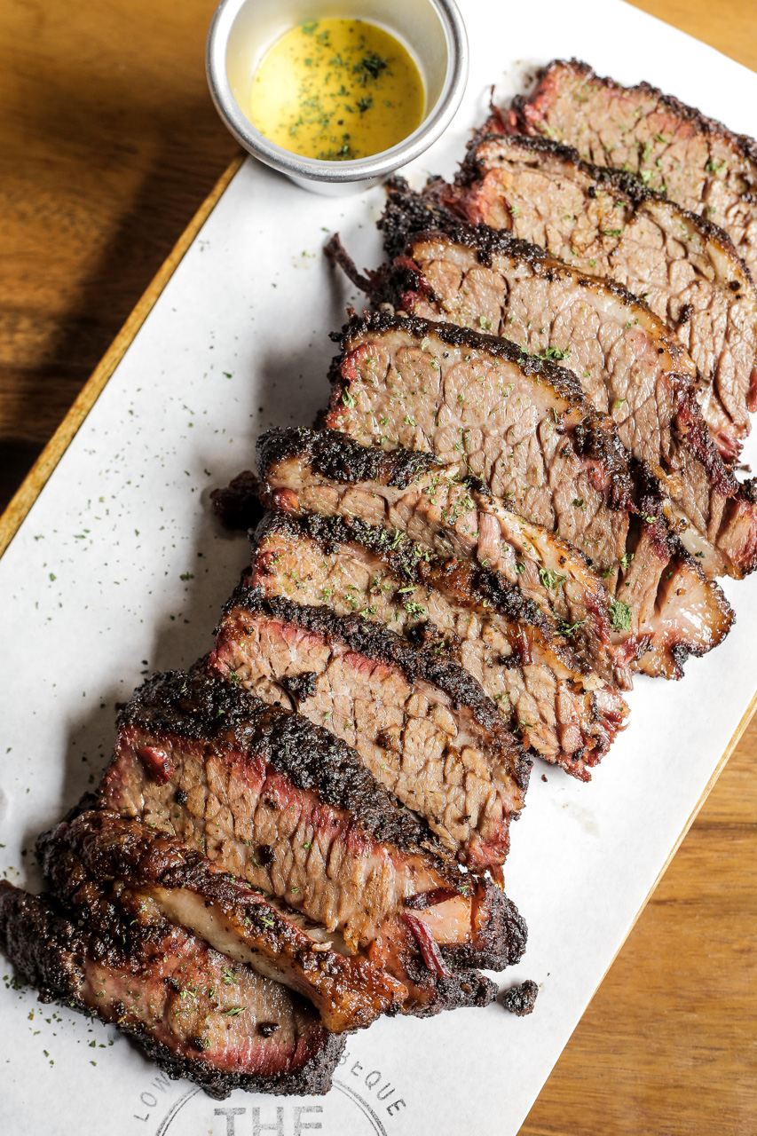 Brisket. You can see the pink smoke ring and caramelized bark, which is a sign of a good smoke.