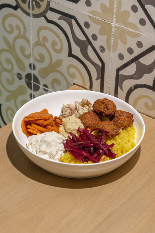 Plant-based restaurants, Two Chickpeas: Falafel bowl with turmeric rice, pickled basil beets, tzatziki, hummus, curried carrots, and creamy tahini cauliflower. Photo by JP Talapian