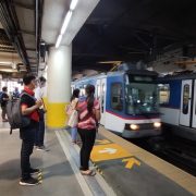 people waiting on train platform MRT