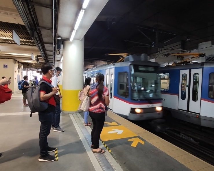 people waiting on train platform MRT