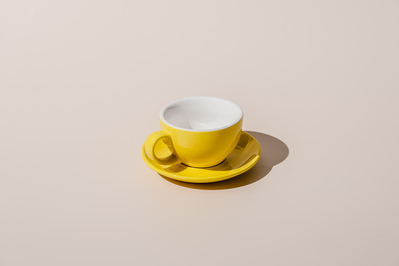 orion coffee cup and saucer in yellow