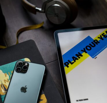 desk with new years resolution essentials planner phone