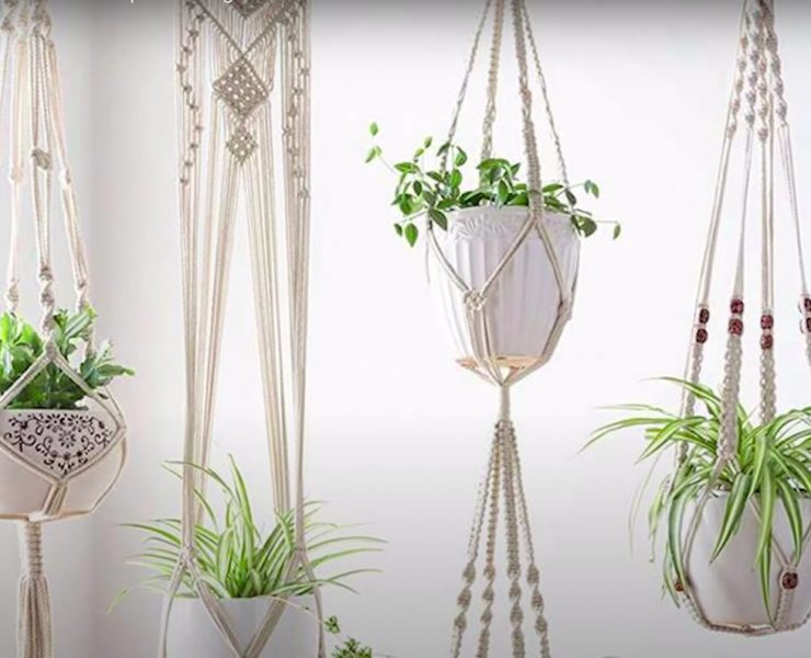 A photo of white macrame hanging planters with potted plant inside courtesy of Tatiana Cm on YouTube