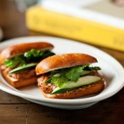 Two fried mantou buns stuffed with chili crab, cilantro, and cucumber from Your Local