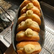 Vanilla custard donuts in a boat shaped bowl