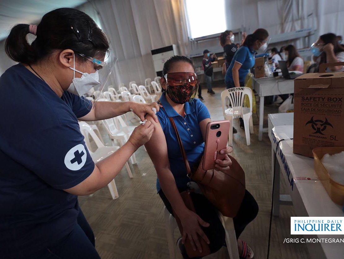 A woman getting vaccinated against the COVID-19 virus, courtesy of Grig Montegrande for Inquirer.net