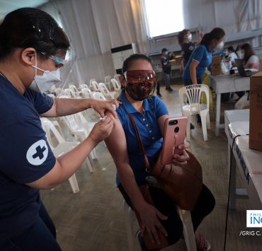 A woman getting vaccinated against the COVID-19 virus, courtesy of Grig Montegrande for Inquirer.net