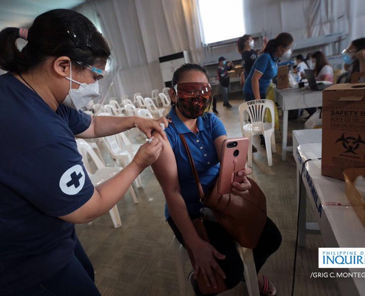 A woman getting vaccinated against the COVID-19 virus, courtesy of Grig Montegrande for Inquirer.net