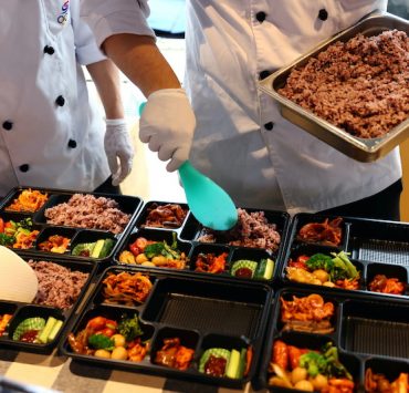 chefs preparing bento meals