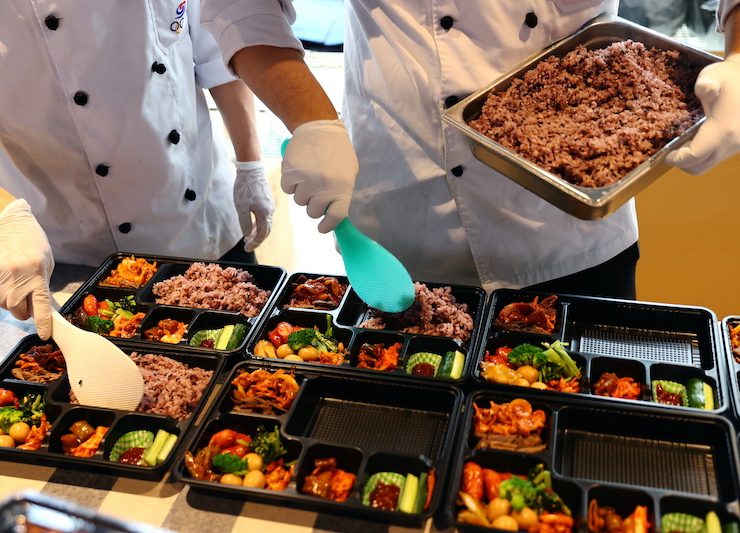 chefs preparing bento meals