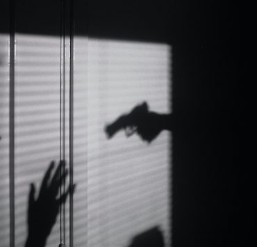 a person held at gunpoint