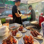 filipino barbecue stall selling grilled skewered innards