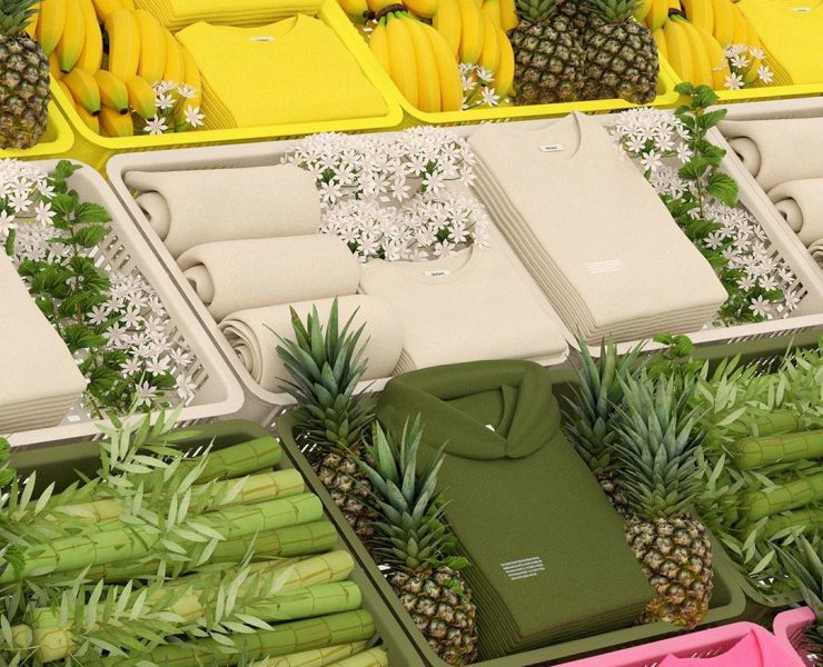 green, cream, and yellow clothes on a fruit stand with pineapples, banana and bamboo