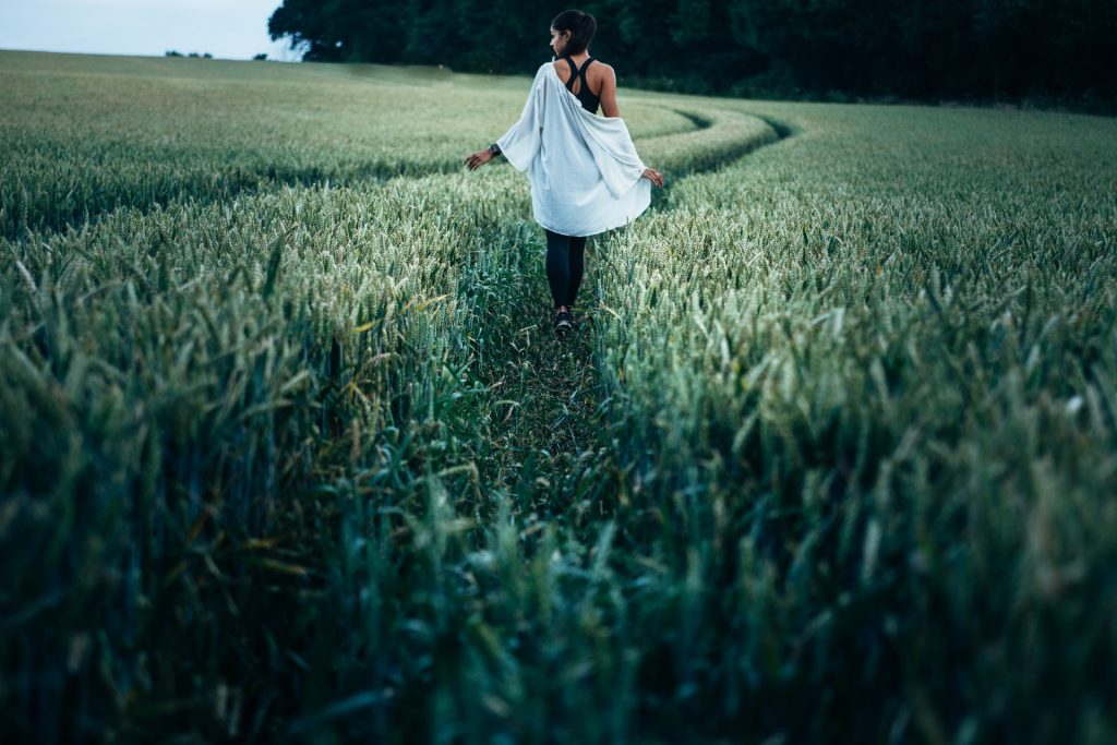 Person touching grass in the daytime