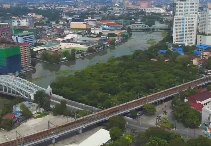 aerial view of arroceros forest park next to the pasig river