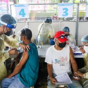 two men being vaccinated in san pedro, laguna by an initiative of the office of the vice president