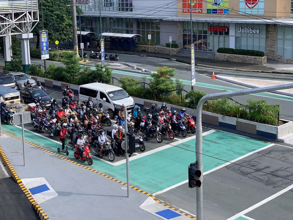 vehicles before a bike box at a red light intersection