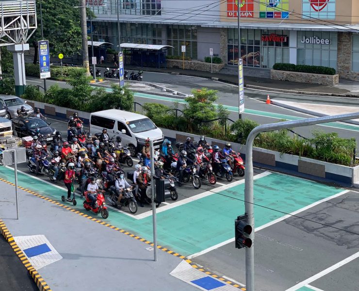 vehicles before a bike box at a red light intersection
