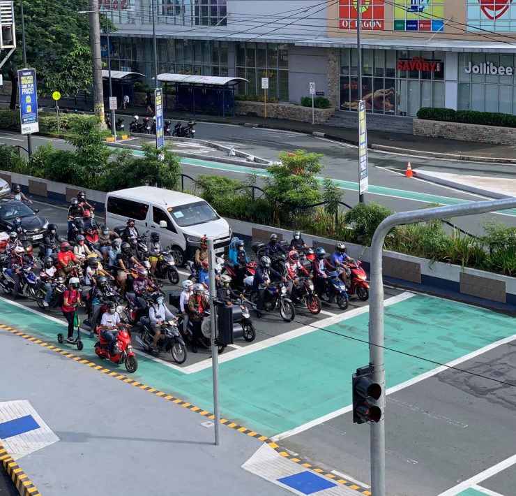 vehicles before a bike box at a red light intersection