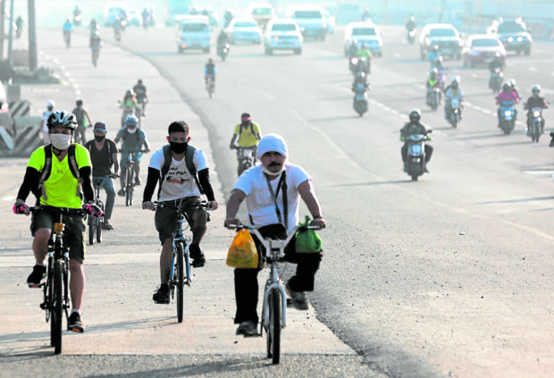 cyclist braving metro manila roads