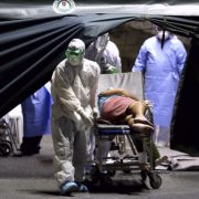 a medical worker rushes a patient in a hospital