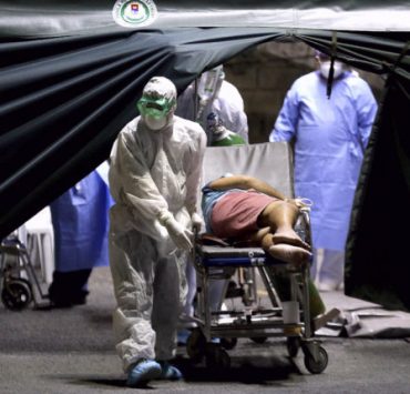 a medical worker rushes a patient in a hospital