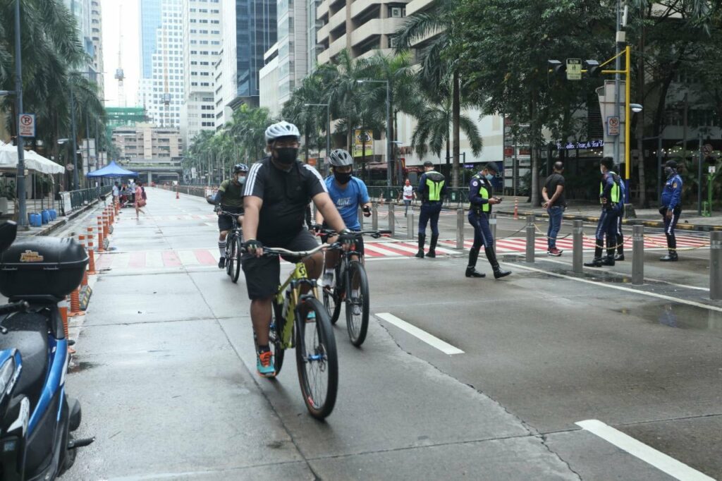 bikers on an empty ortigas street