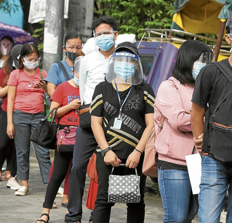 commuters wearing face shield