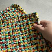 a hand holding a woven basahan mat
