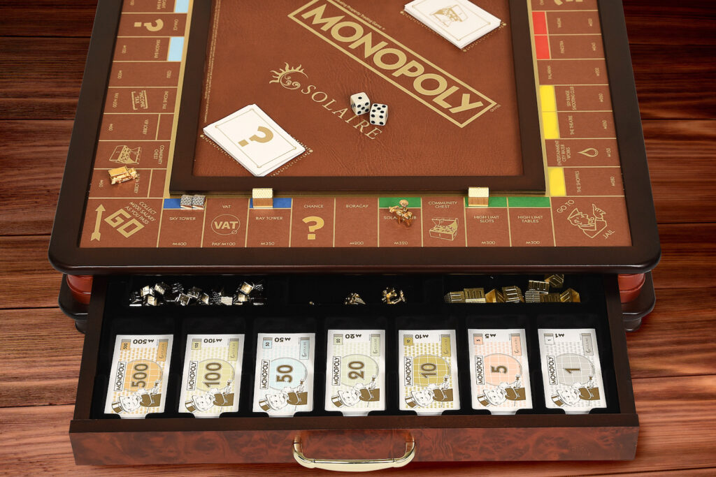 How do you reinvent the traditional Monopoly board game? Utilize faux leather and premium wood material