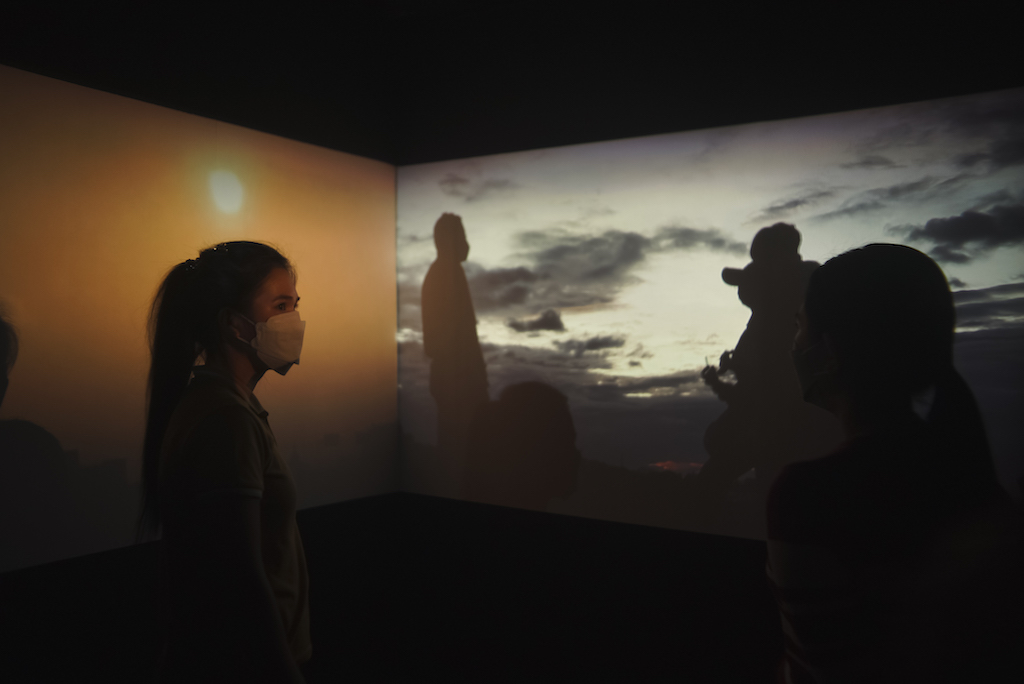 “To Watch The Sunset Once Again,” a two-channel video consisting of a slideshow of sunset images gathered from Kristoff’s original series ”Grindr Sunsets” (2019-2022), premiered last March 10 at the Cultural Center of the Philippines during the opening of Thirteen Artist Awards group exhibition | Photo by Dennese Victoria/Cultural Center of the Philippines