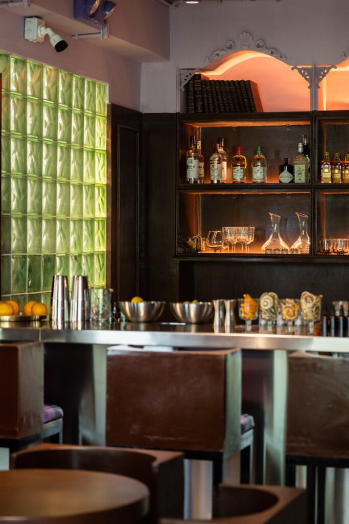 Grab a drink immediately after you clock out at HereAfter's cozy bar