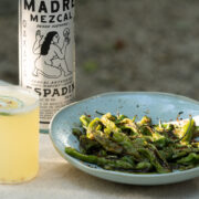 mezcal cocktail and roasted shishito peppers