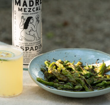 mezcal cocktail and roasted shishito peppers