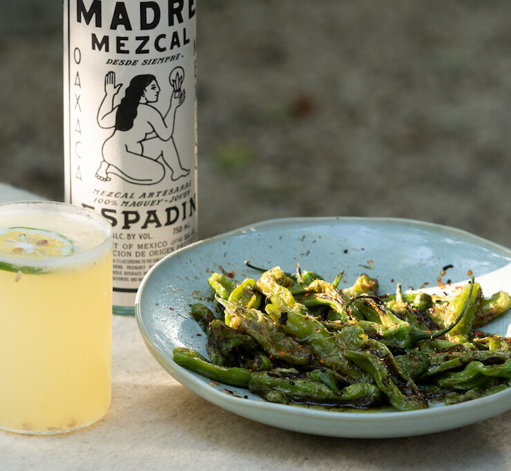 mezcal cocktail and roasted shishito peppers