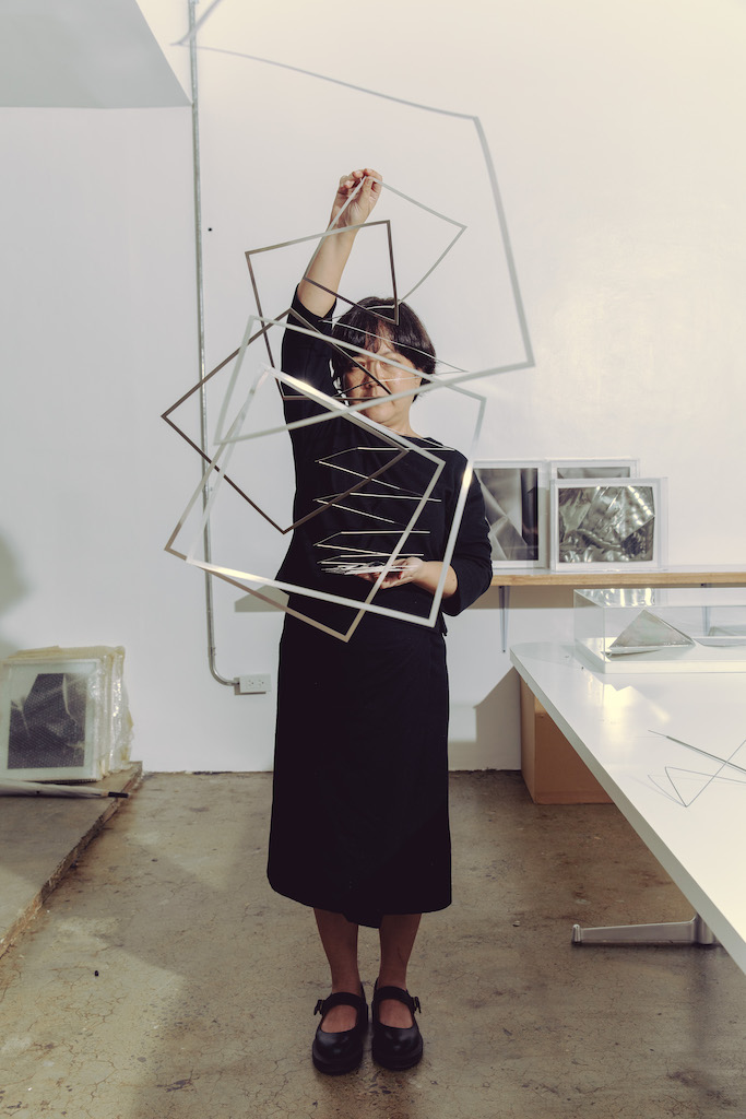 Micaela Benedicto with Helix I, a 3-dimensional “scribble” made out of stainless steel sheet