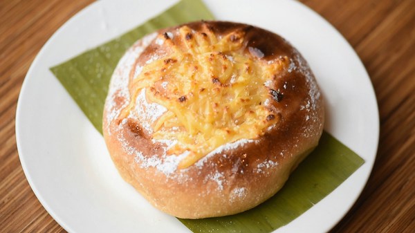 Ensaymada or cheese rolls with a side hot coffee or tea (often both literally and figuratively), are the go-to merienda for people who frequent these establishments. Photo by Christian Dala/Unsplash