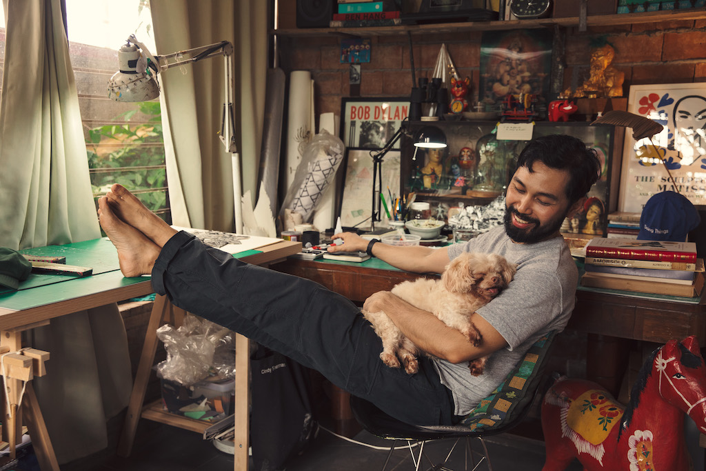 artist ryan villamael with his dog in his studio in los baños, laguna