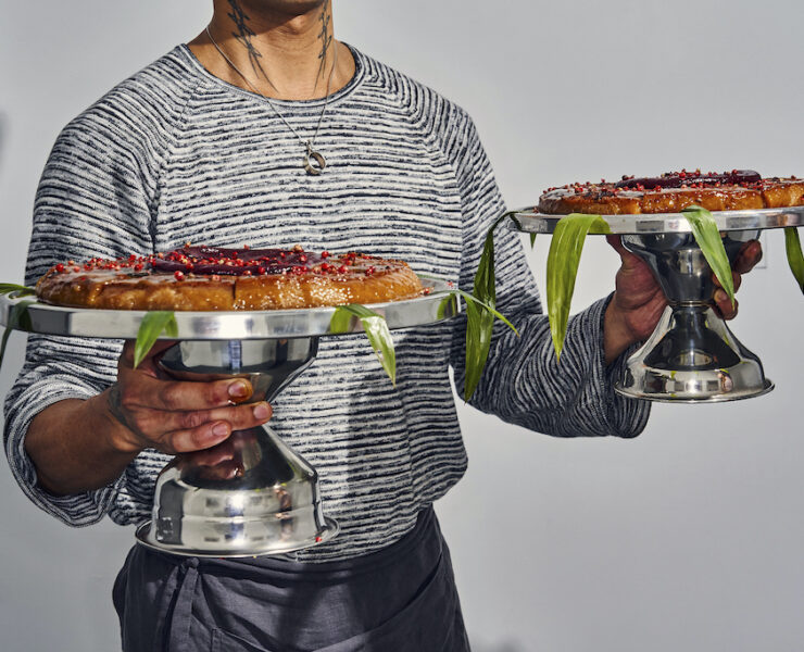 lj almendras holding two sweet rice cake with coconut caramel and chamoy